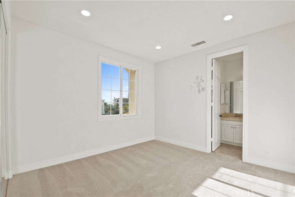 4925 Lone Acres Court Rancho Cucamonga, CA 91737 - Photo 50 of 68 an empty room with window and bathroom