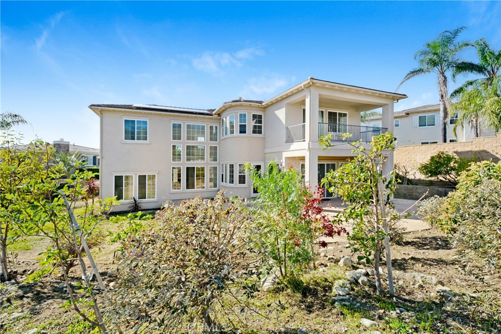 4925 Lone Acres Court Rancho Cucamonga, CA 91737 - Photo 5 of 68 a front view of a house with a yard