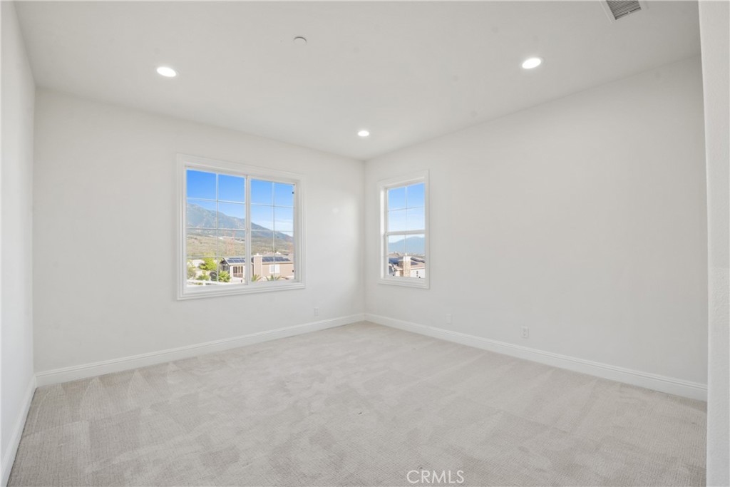 4925 Lone Acres Court Rancho Cucamonga, CA 91737 - Photo 52 of 68 an empty room with windows