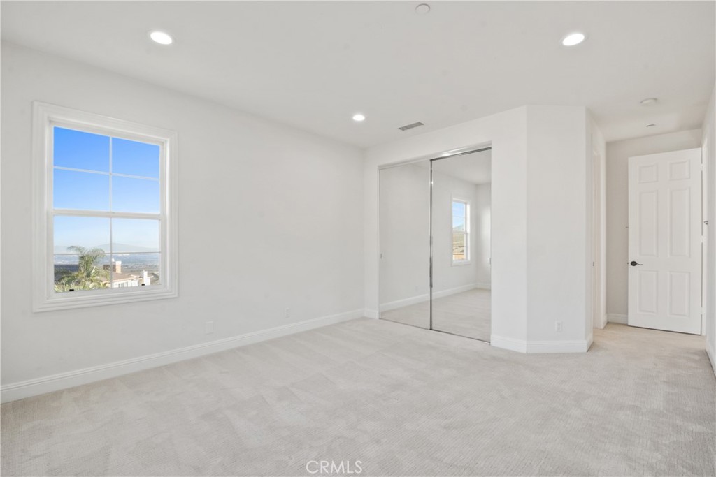 4925 Lone Acres Court Rancho Cucamonga, CA 91737 - Photo 53 of 68 an empty room with windows and closet