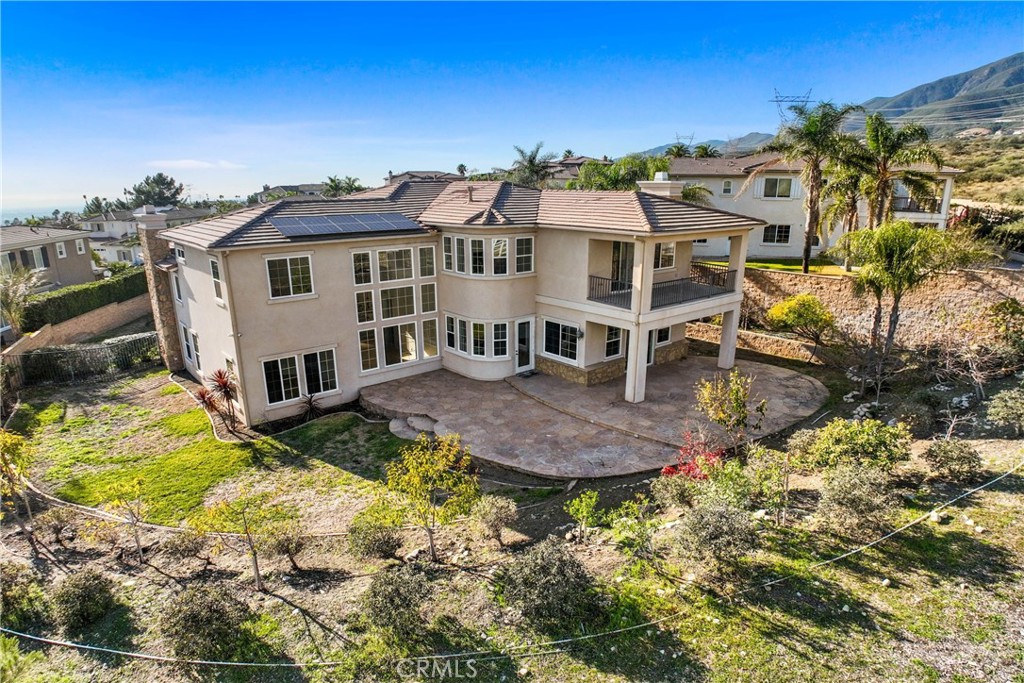 4925 Lone Acres Court Rancho Cucamonga, CA 91737 - Photo 60 of 68 a view of a house with a big yard and large trees