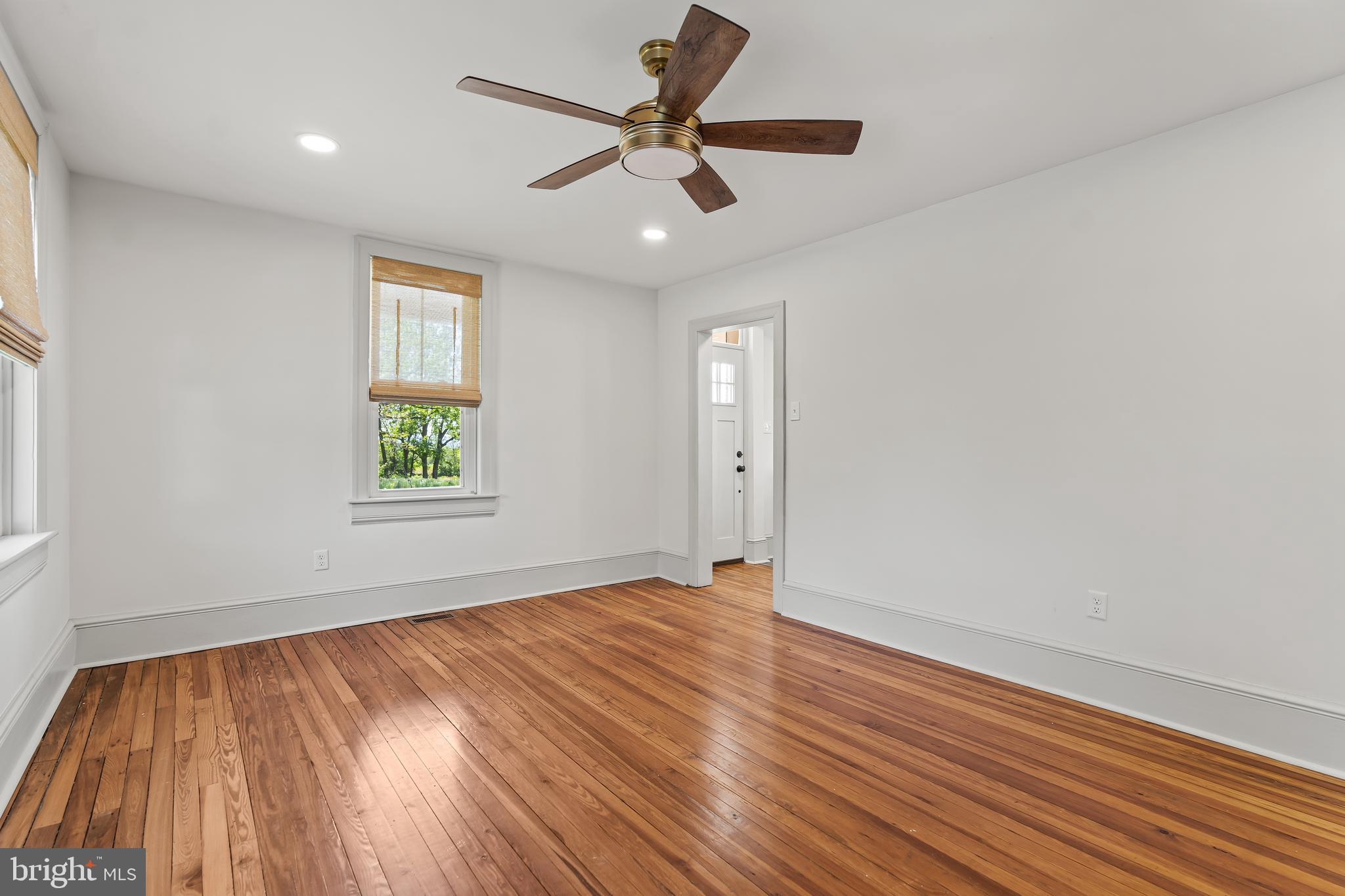 14005 Dry Run Road Clear Spring, MD 21722 - Photo 27 of 44 wooden floor in an empty room with a window