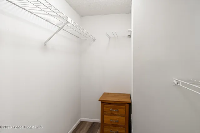 a small space with a table and a window