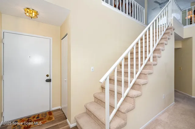 a view of entryway with wooden floor