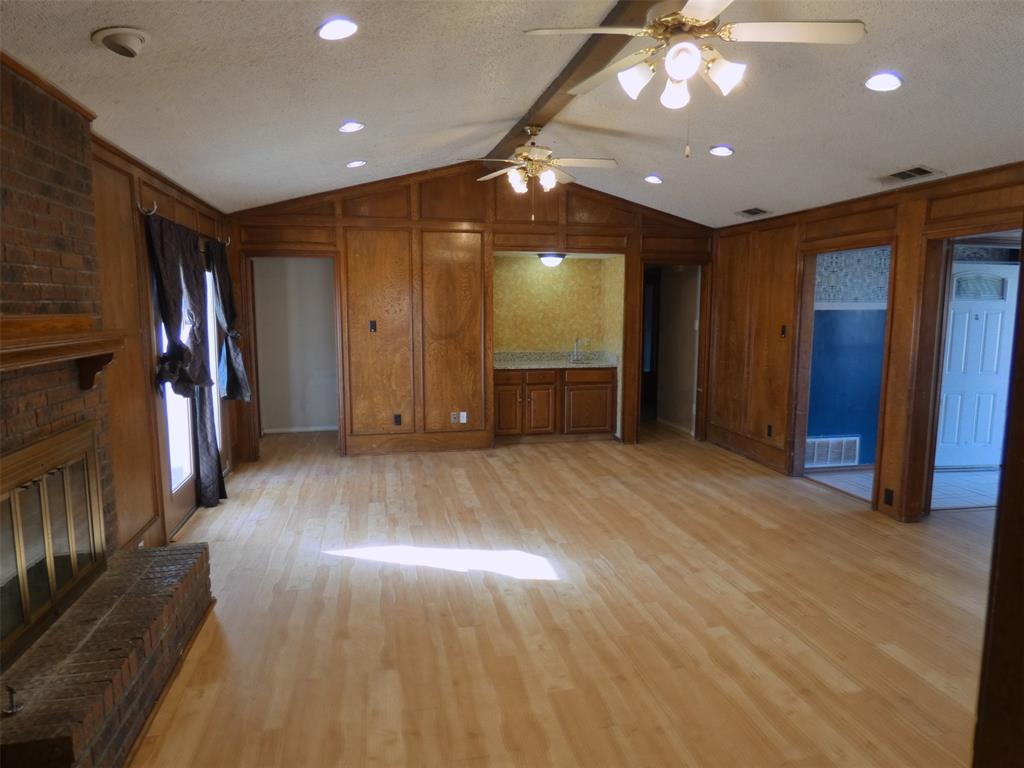 7110 Ridgeview Drive Rowlett, TX 75089 - Photo 4 of 27 a view of empty room with wooden floor