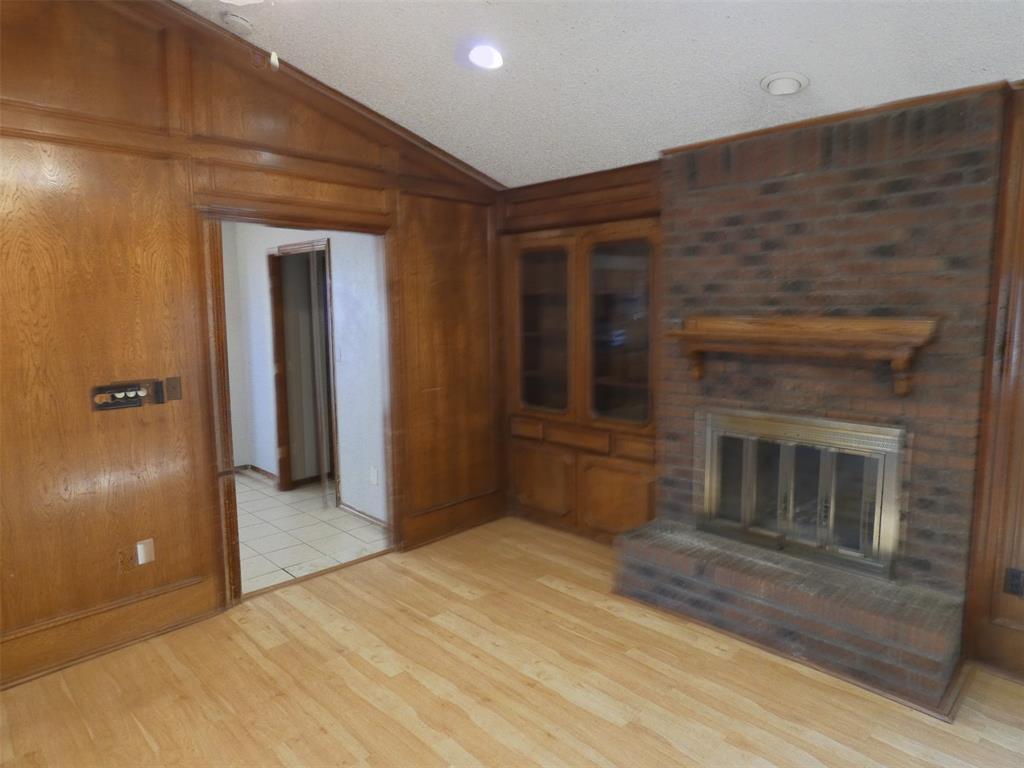 7110 Ridgeview Drive Rowlett, TX 75089 - Photo 7 of 27 a view of a hallway with wooden floor