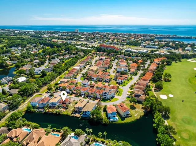 an aerial view of residential building and ocean view