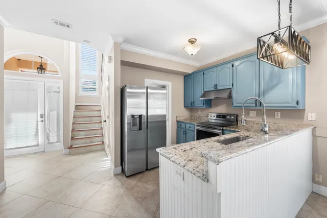 a kitchen with a refrigerator a sink and dishwasher