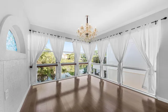a view of an entryway with wooden floor