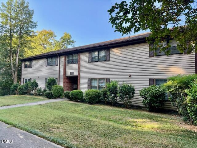 1208 Manassas Court, Unit A Raleigh, NC 27609 - Photo 1 of 16 a front view of a house with garden