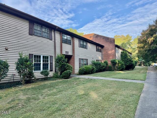 1208 Manassas Court, Unit A Raleigh, NC 27609 - Photo 2 of 16 a front view of a house with garden