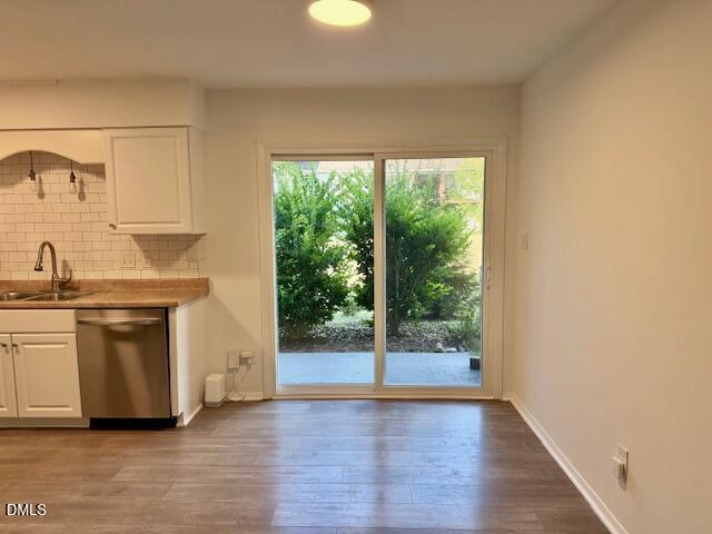 1208 Manassas Court, Unit A Raleigh, NC 27609 - Photo 5 of 16 a kitchen with a sink and a large window