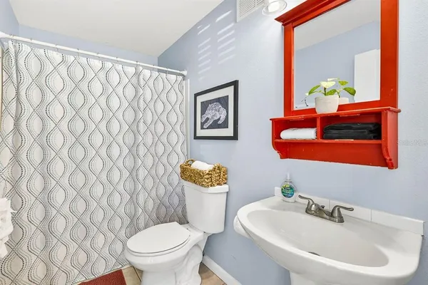 a bathroom with a toilet and a sink