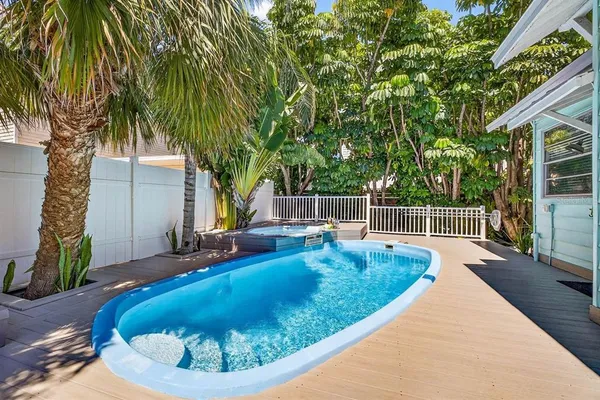 a view of a swimming pool with a patio