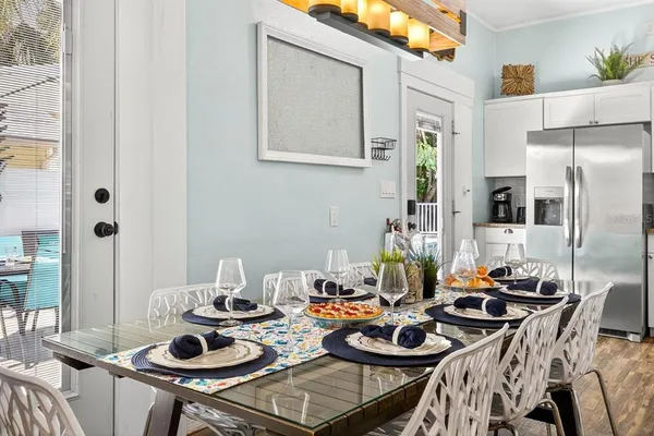 a kitchen with a table and chairs in it