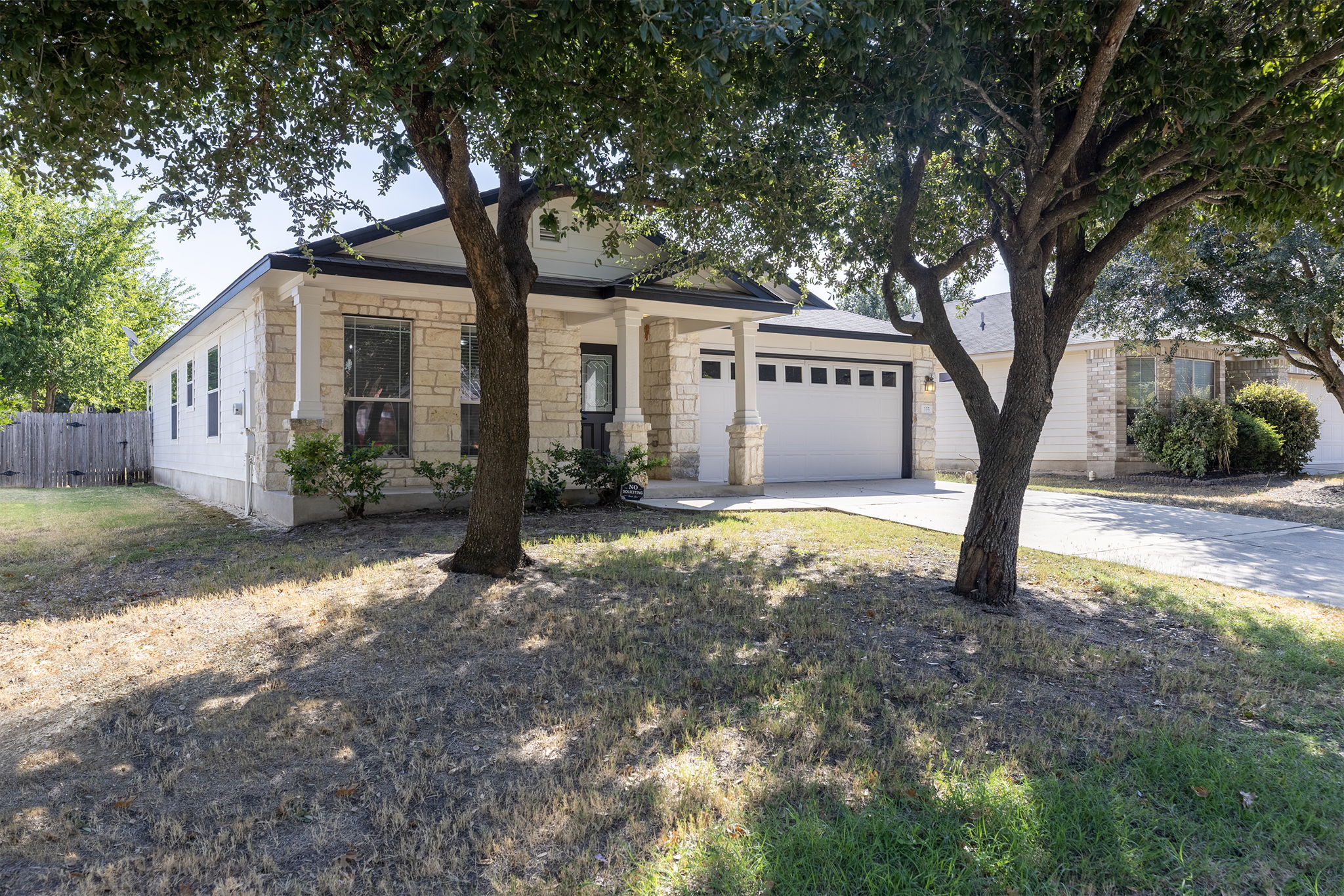 335 Altamont Street Hutto, TX 78634 - Photo 1 of 40 a front view of a house with garden