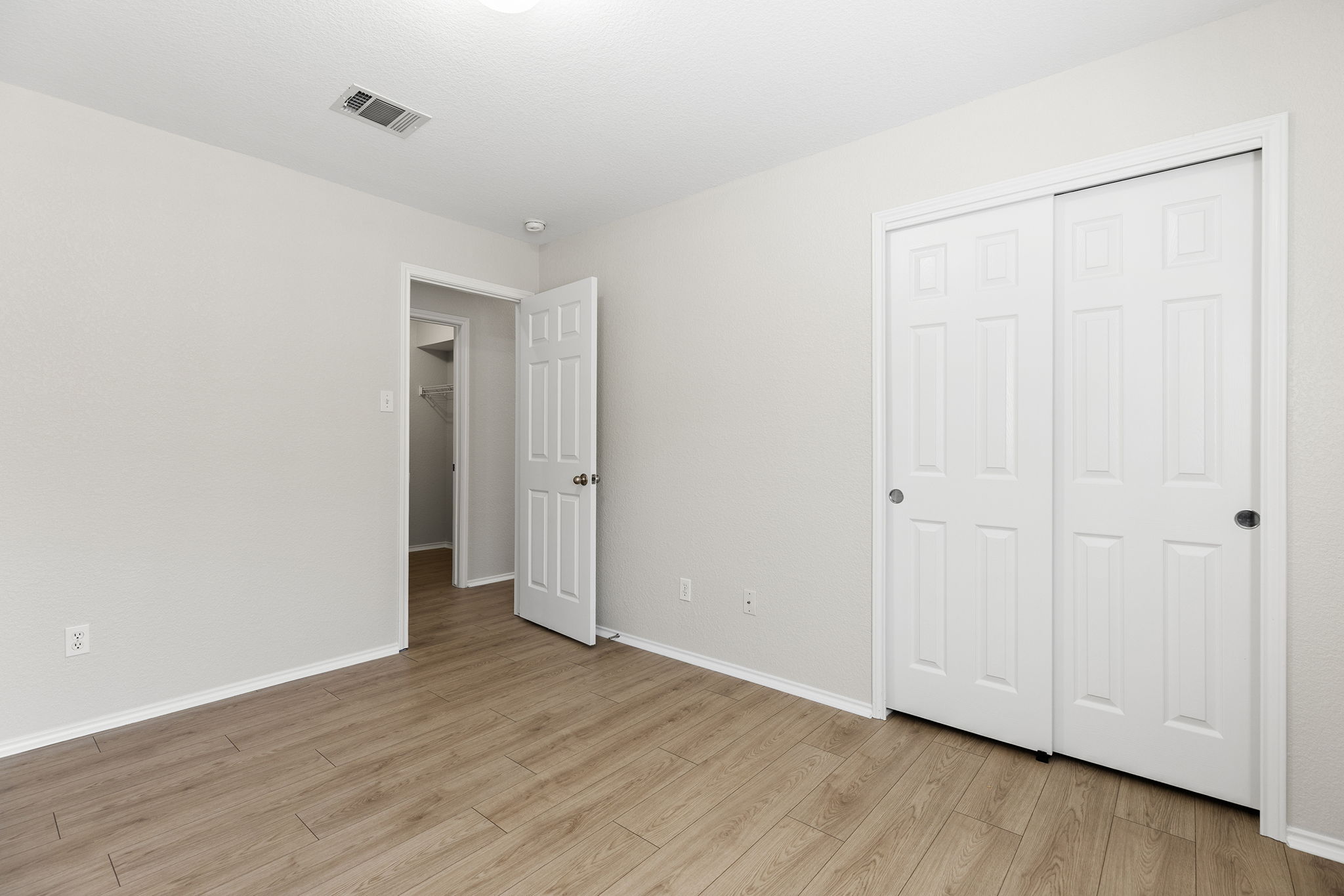 335 Altamont Street Hutto, TX 78634 - Photo 28 of 40 a view of an empty room with wooden floor