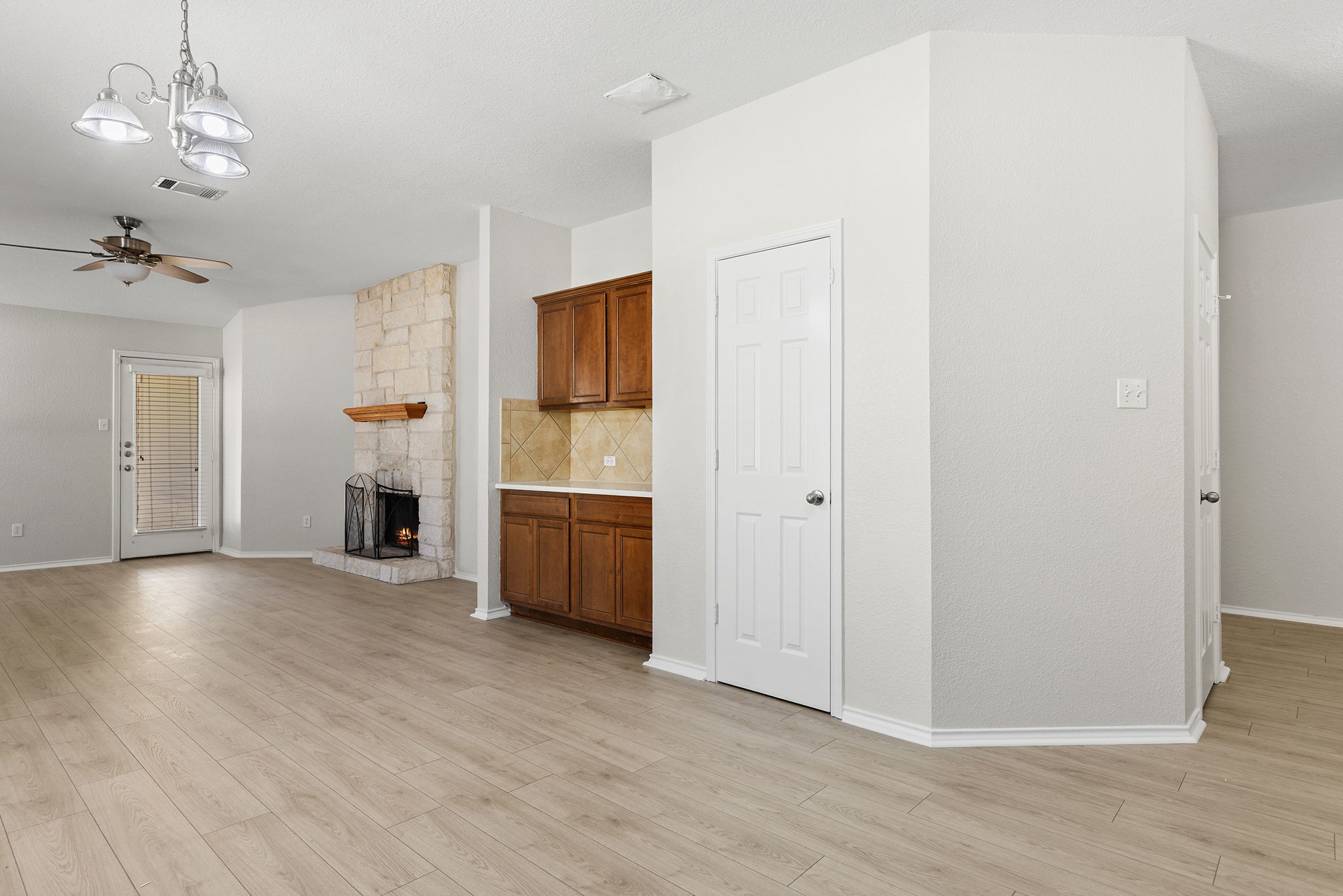 335 Altamont Street Hutto, TX 78634 - Photo 8 of 40 a view of a livingroom with a chandelier