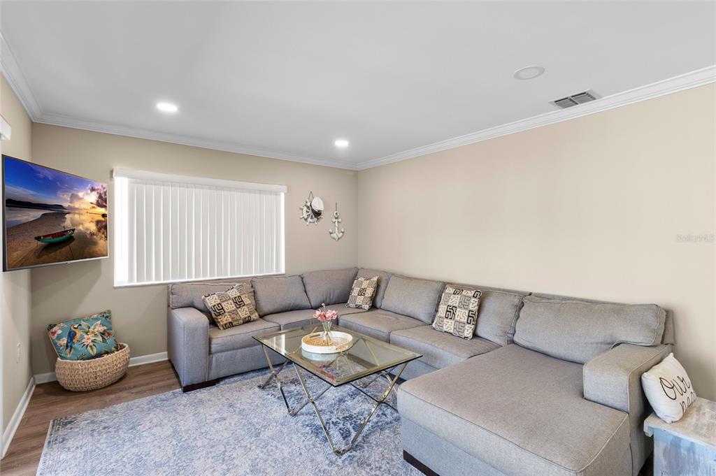 1579 Greenlea Drive, Unit 12 Clearwater, FL 33755 - Photo 12 of 42 a living room with furniture and a couch