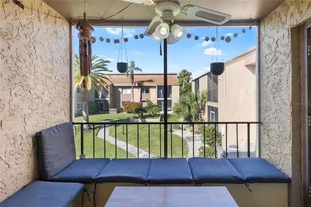 a view of a balcony with furniture