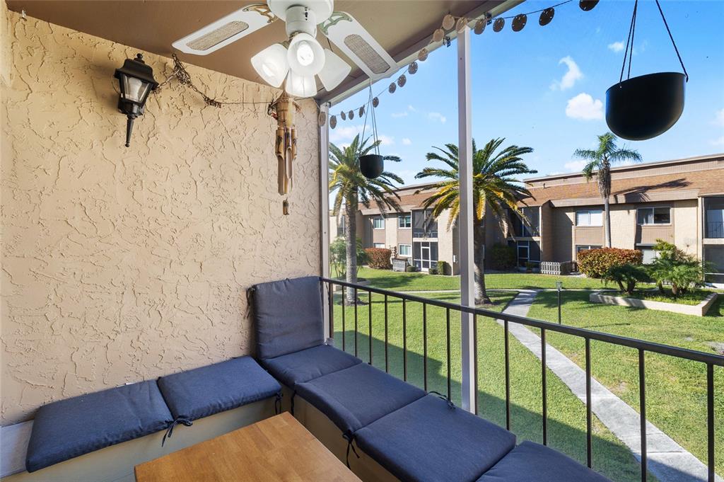 1579 Greenlea Drive, Unit 12 Clearwater, FL 33755 - Photo 14 of 42 a view of a balcony with chairs