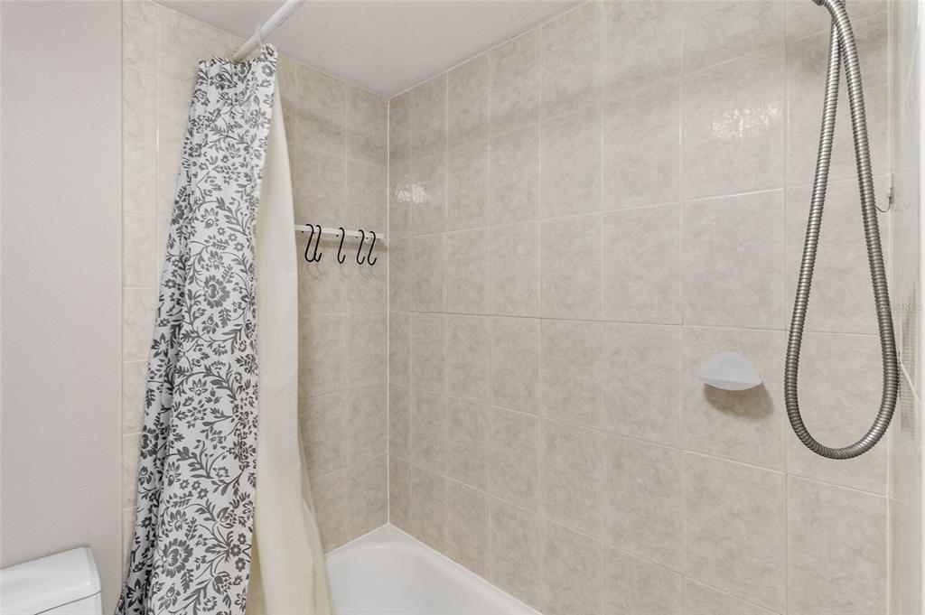 1579 Greenlea Drive, Unit 12 Clearwater, FL 33755 - Photo 26 of 42 a bathroom with a shower