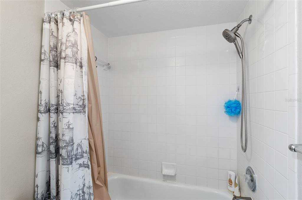 1579 Greenlea Drive, Unit 12 Clearwater, FL 33755 - Photo 28 of 42 a bathroom with a shower