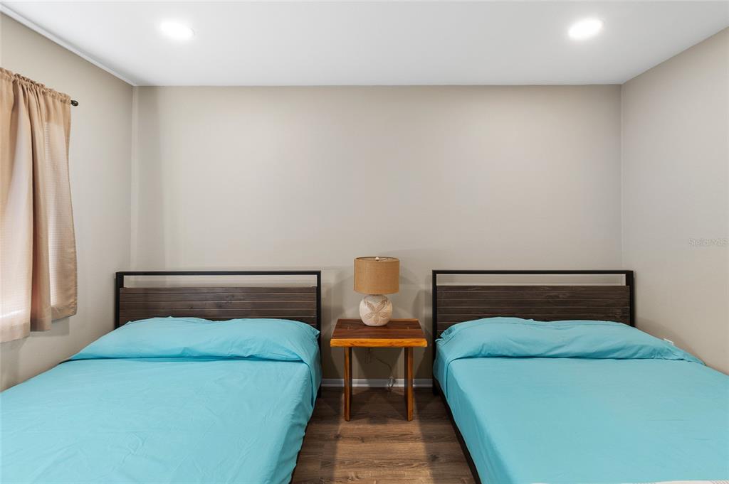 1579 Greenlea Drive, Unit 12 Clearwater, FL 33755 - Photo 31 of 42 a bedroom with a bed and window