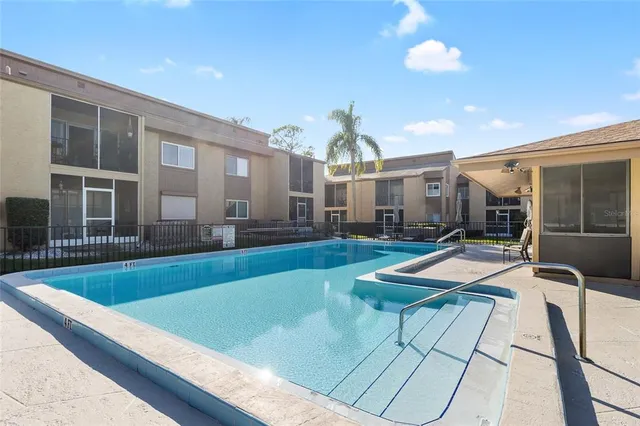 a view of a living room and kitchen