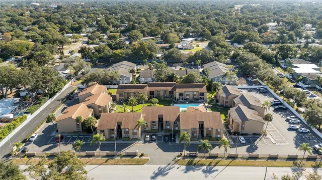 an aerial view of a building with garden