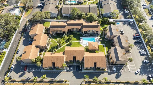 an aerial view of houses with outdoor space