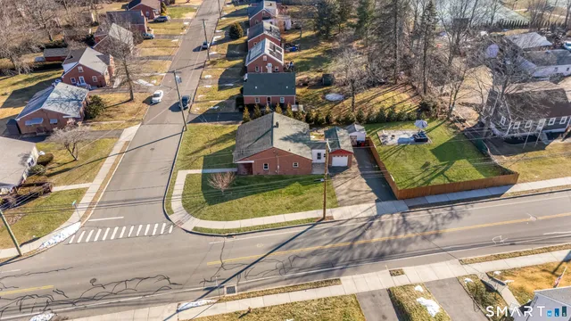a view of a park with couches in a patio