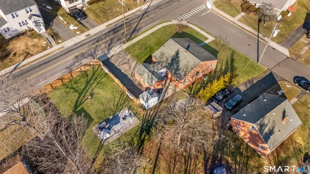 a view of a chair and tables in the patio next to a lake