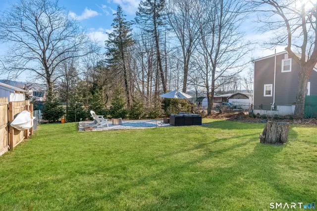 a bathroom with mirror and tiles