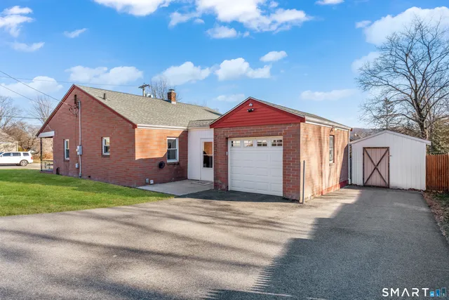a kitchen with stainless steel appliances a sink a stove and cabinets