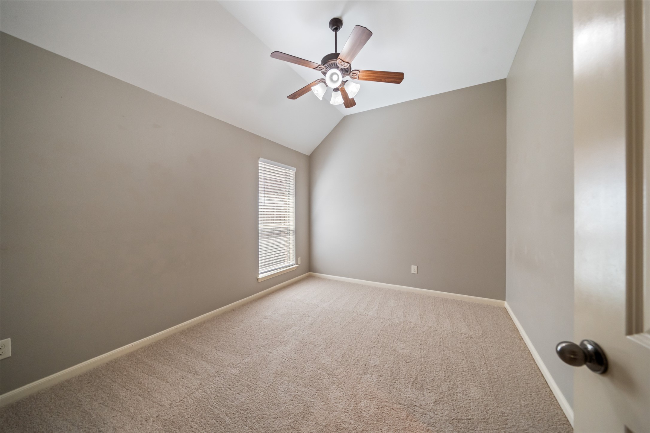 2818 Red Maple Drive Katy, TX 77494 - Photo 17 of 50 First of 4 bedroom features neutral walls and new carpet, with natural light coming through a window with blinds.