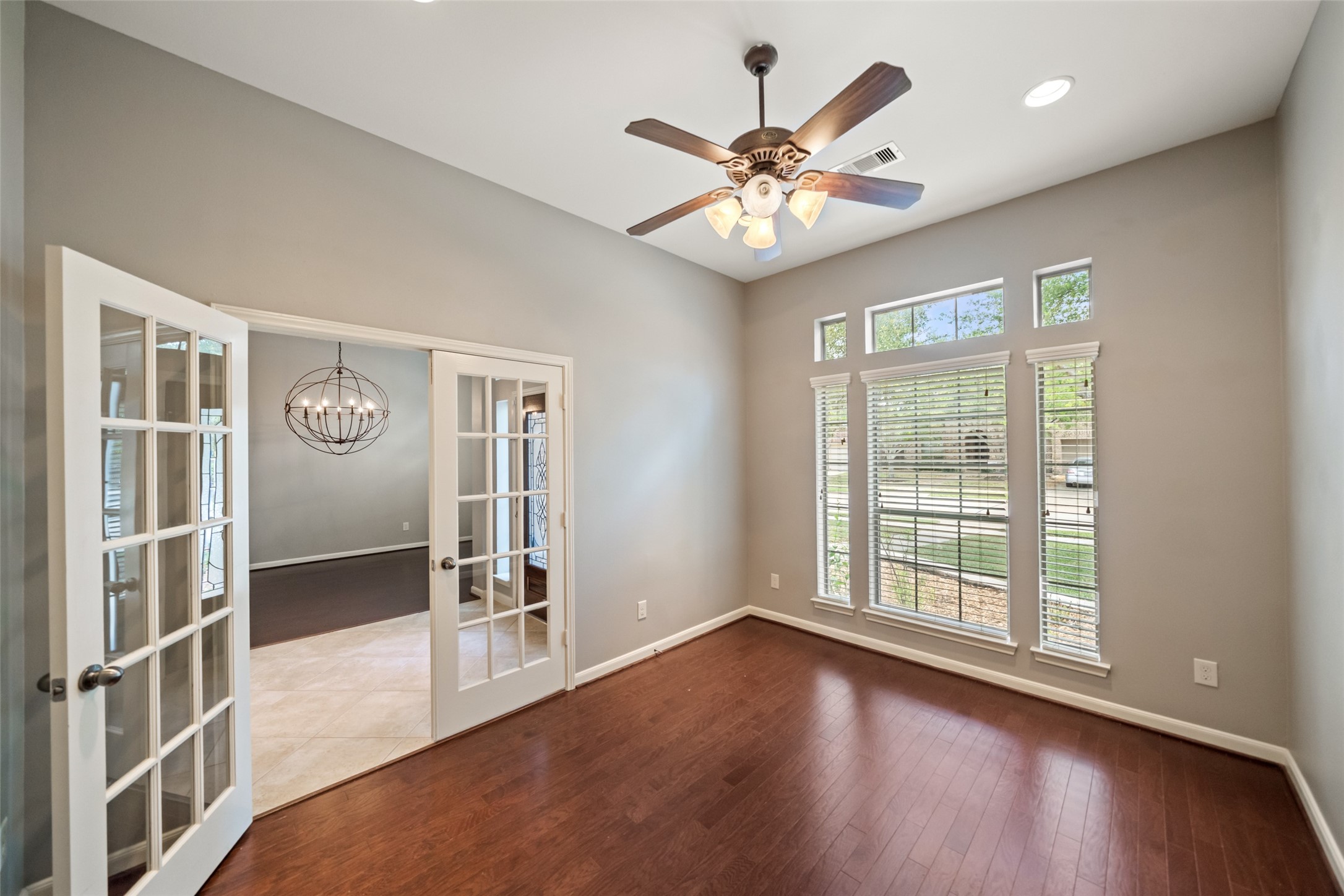 2818 Red Maple Drive Katy, TX 77494 - Photo 7 of 50 The study has French doors leading to an adjacent space, creating an open and airy feel.
