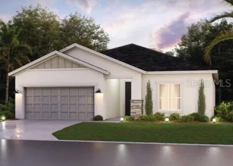 a front view of a house with a garden and garage