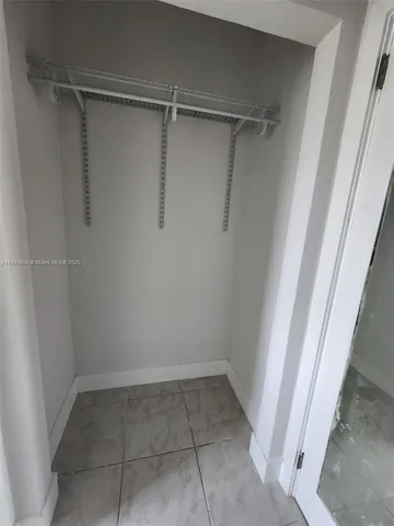a view of an empty walk in closet