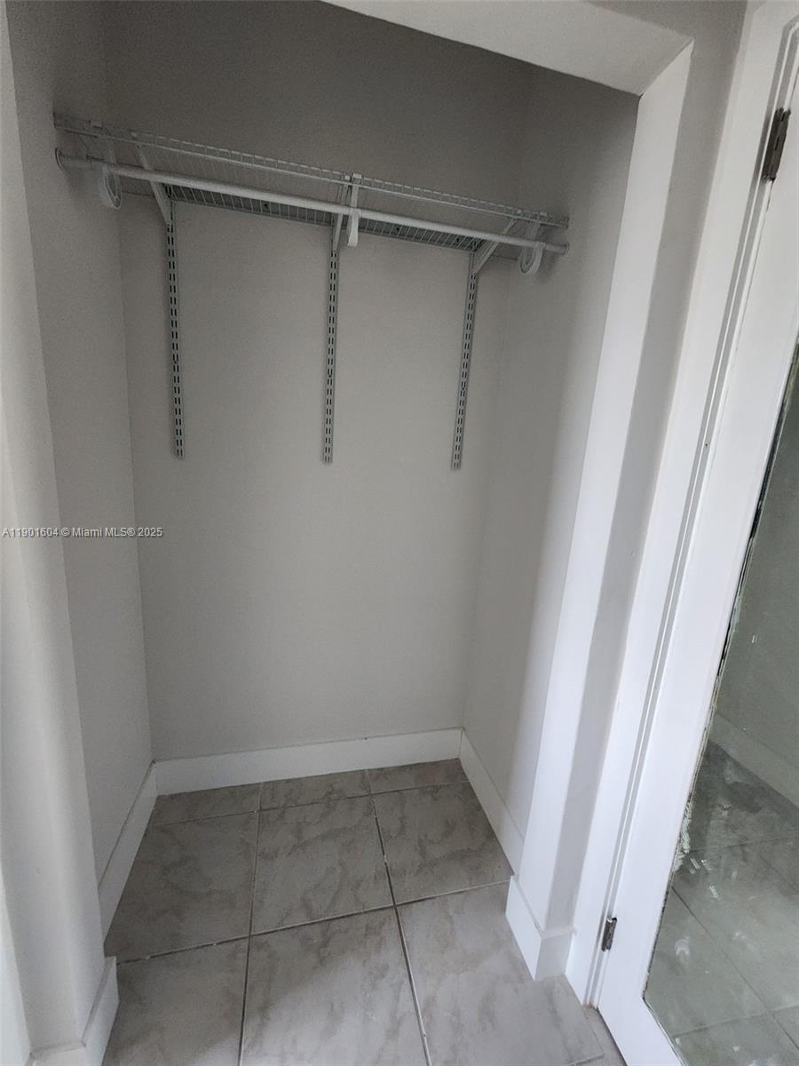 7611 Harding Avenue, Unit 9 Miami Beach, FL 33141 - Photo 11 of 15 a view of an empty walk in closet