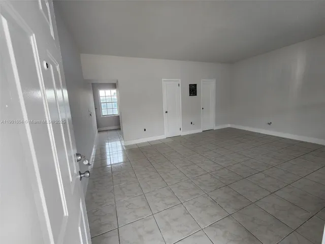 an empty room with a fireplace