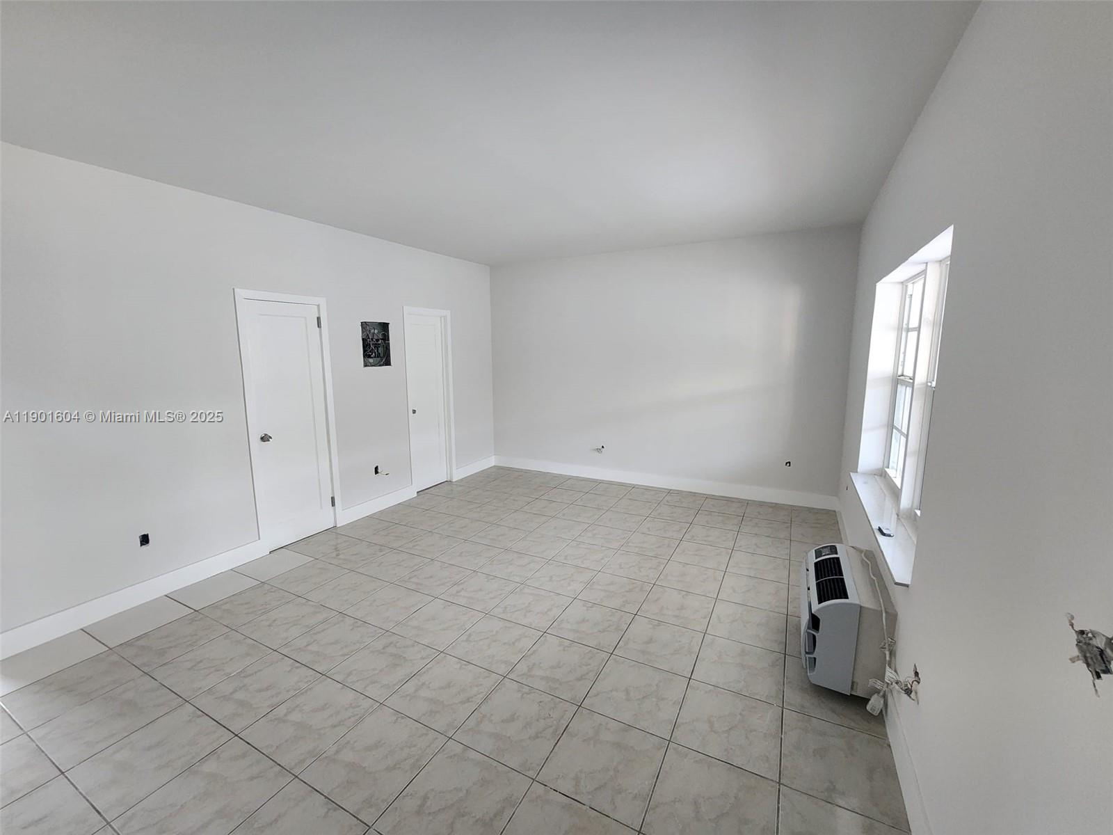 7611 Harding Avenue, Unit 9 Miami Beach, FL 33141 - Photo 5 of 15 a view of an empty room