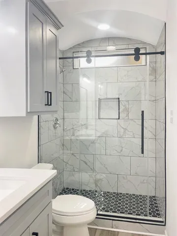 a bathroom with a toilet and a sink