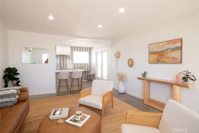 a living room with a couch chair and a fireplace