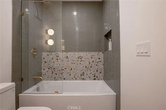 a kitchen with kitchen island stainless steel appliances a stove a sink and a stove