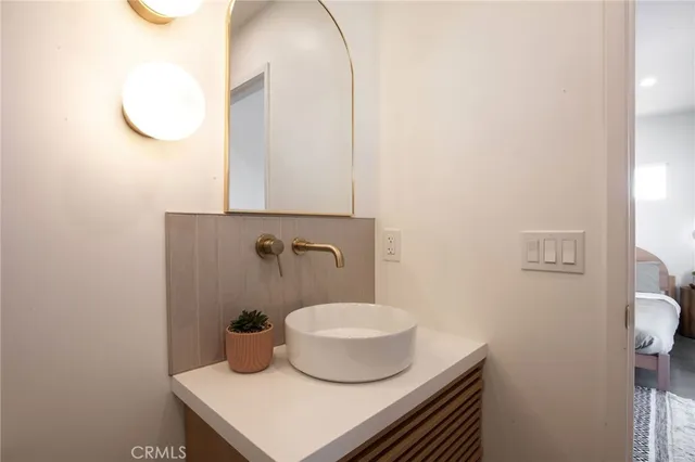 a living room with lots of furniture and a large window