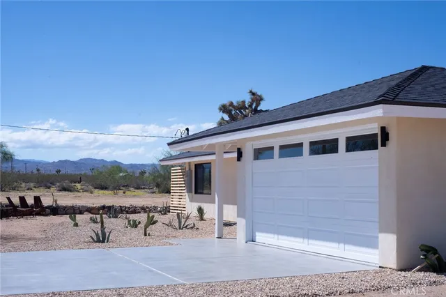 a very nice looking room with a large window and wooden floor