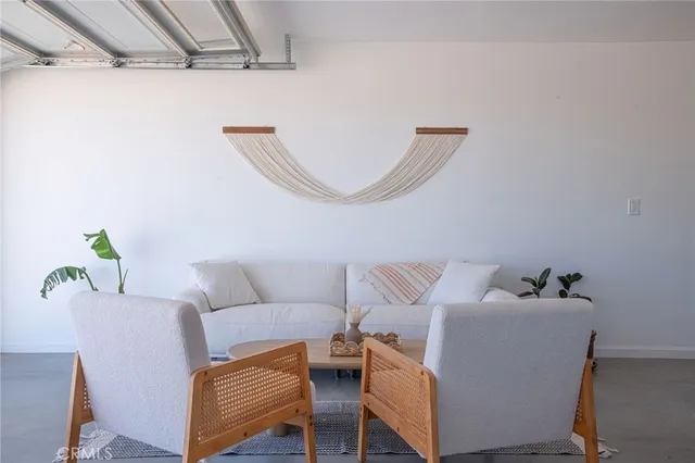 a view of a backyard with sitting area