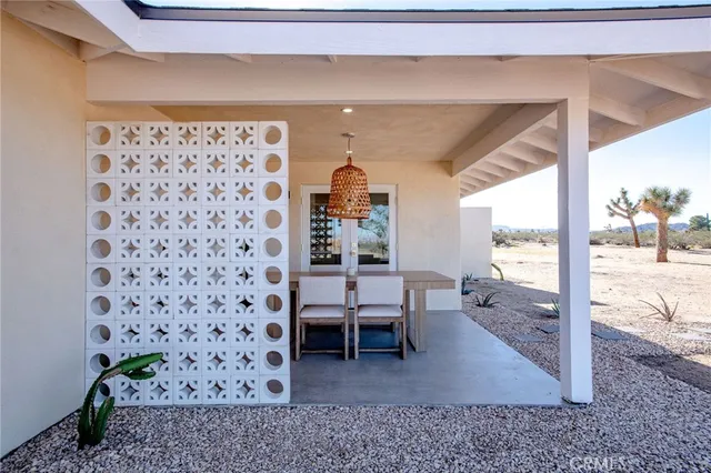 a dining room with table and chairs