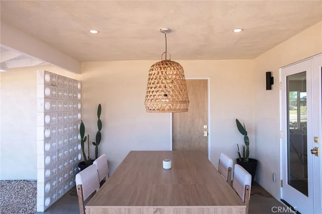 a living room with furniture a wooden floor and a table